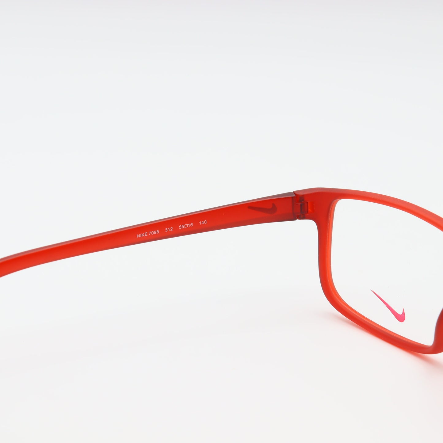 Red Nike square eyeglasses with lightweight sports frame, designed by CHASHMAY KHAS® for comfortable active wear.