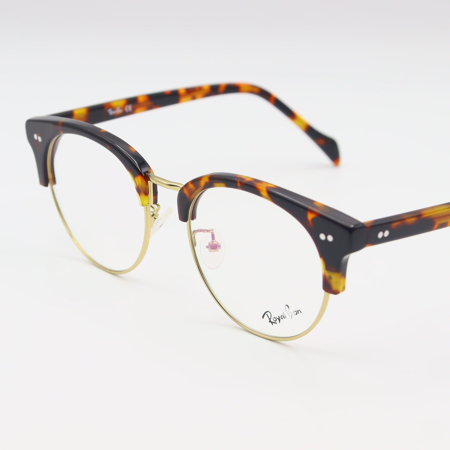 Round tortoiseshell eyeglasses by CHASHMAY KHAS® featuring classic spectacles design and clear lenses.