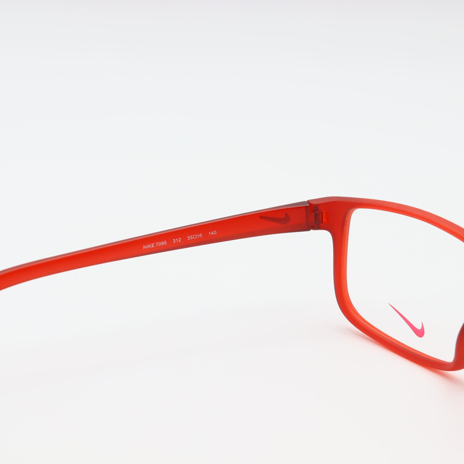 Red Nike square eyeglasses with lightweight sports frame, designed by CHASHMAY KHAS® for comfortable active wear.