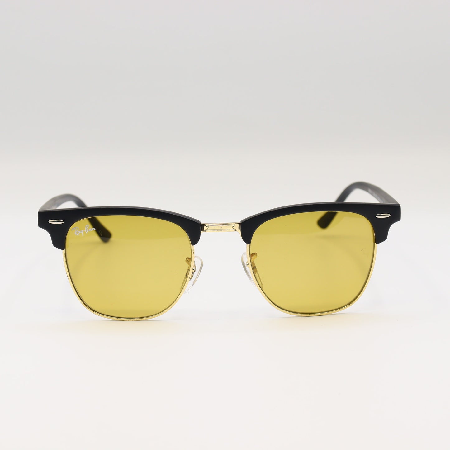 RayBan RB3016 Clubmaster sunglasses with black and tortoiseshell frame, metal accents, and dark lenses.