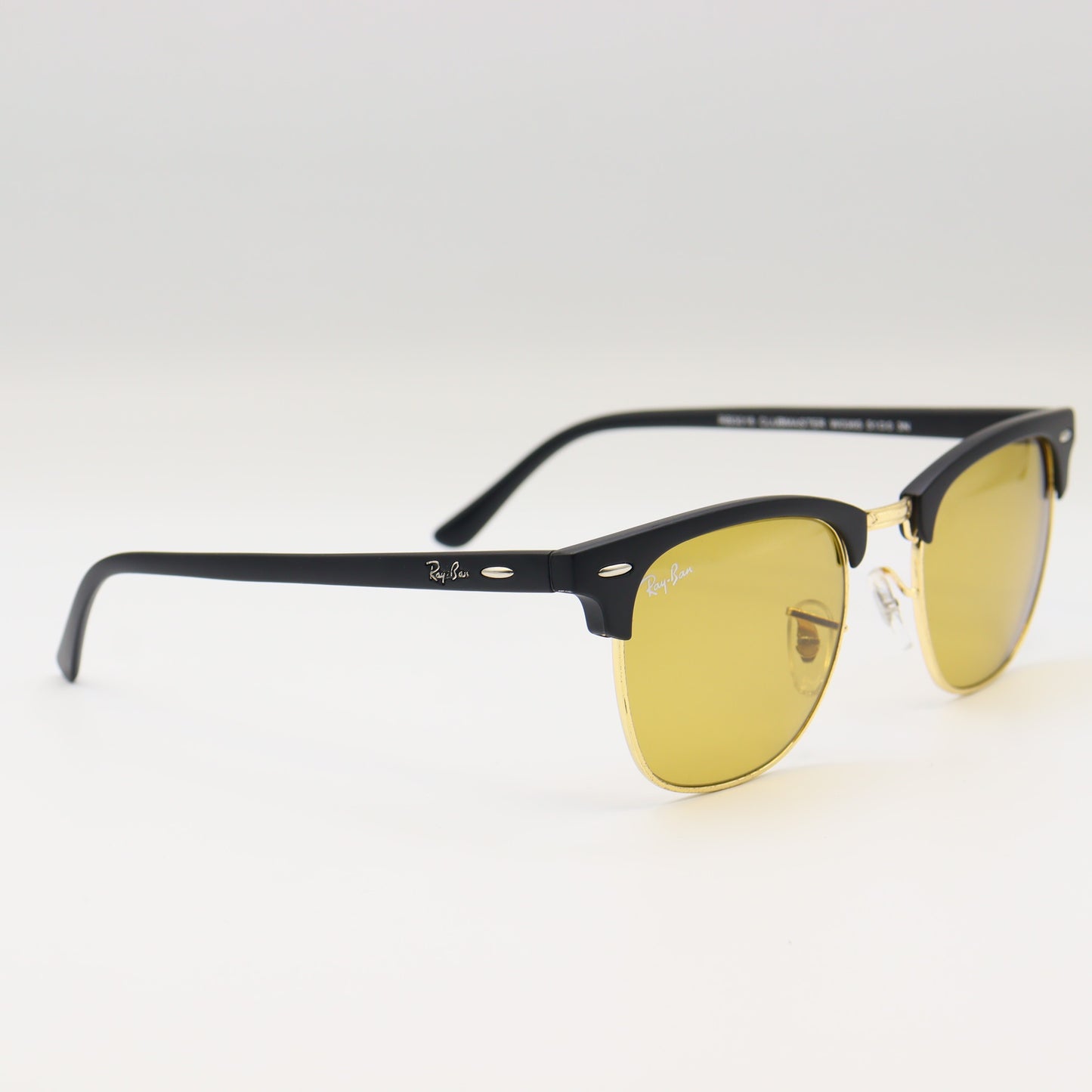 Chashmay Khas RayBan RB3016 Clubmaster sunglasses with black and gold frames and dark lenses on a white background.