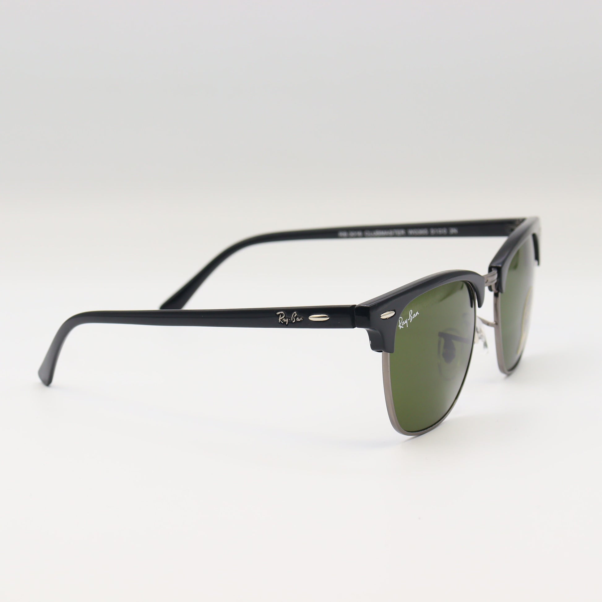 RayBan RB3016 Clubmaster sunglasses with black and tortoise shell frames, featuring metal accents and dark lenses.