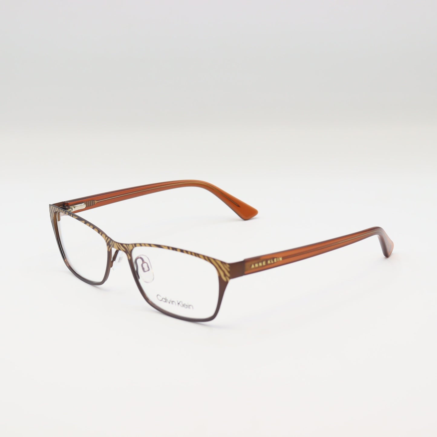 Calvin Klein zebra print rectangular spectacles in brown animal pattern with black accents, stylish eyeglasses by CHASHMAY KHAS®.
