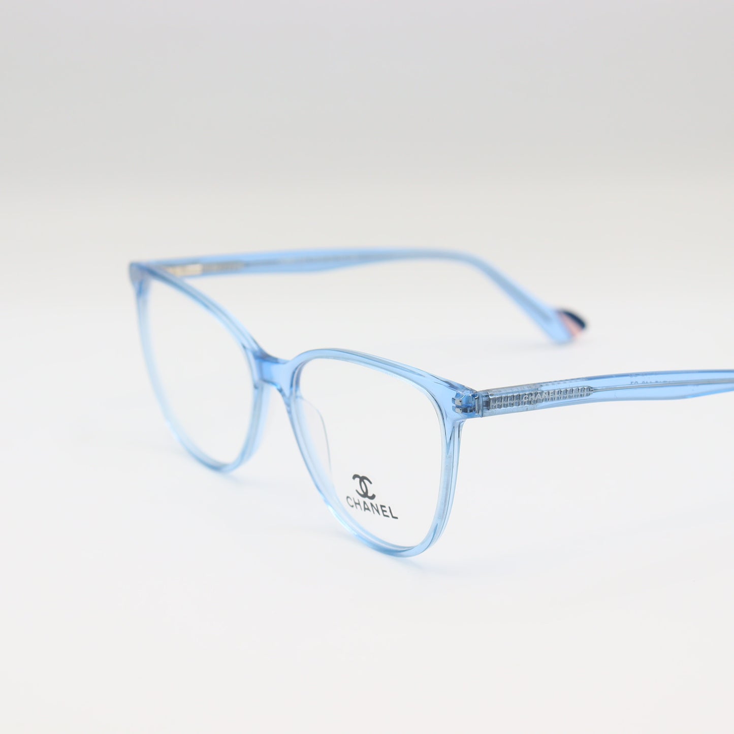 Chanel Light Blue Cat-Eye eyeglasses with transparent acetate frames from CHASHMAY KHAS® on a white background.