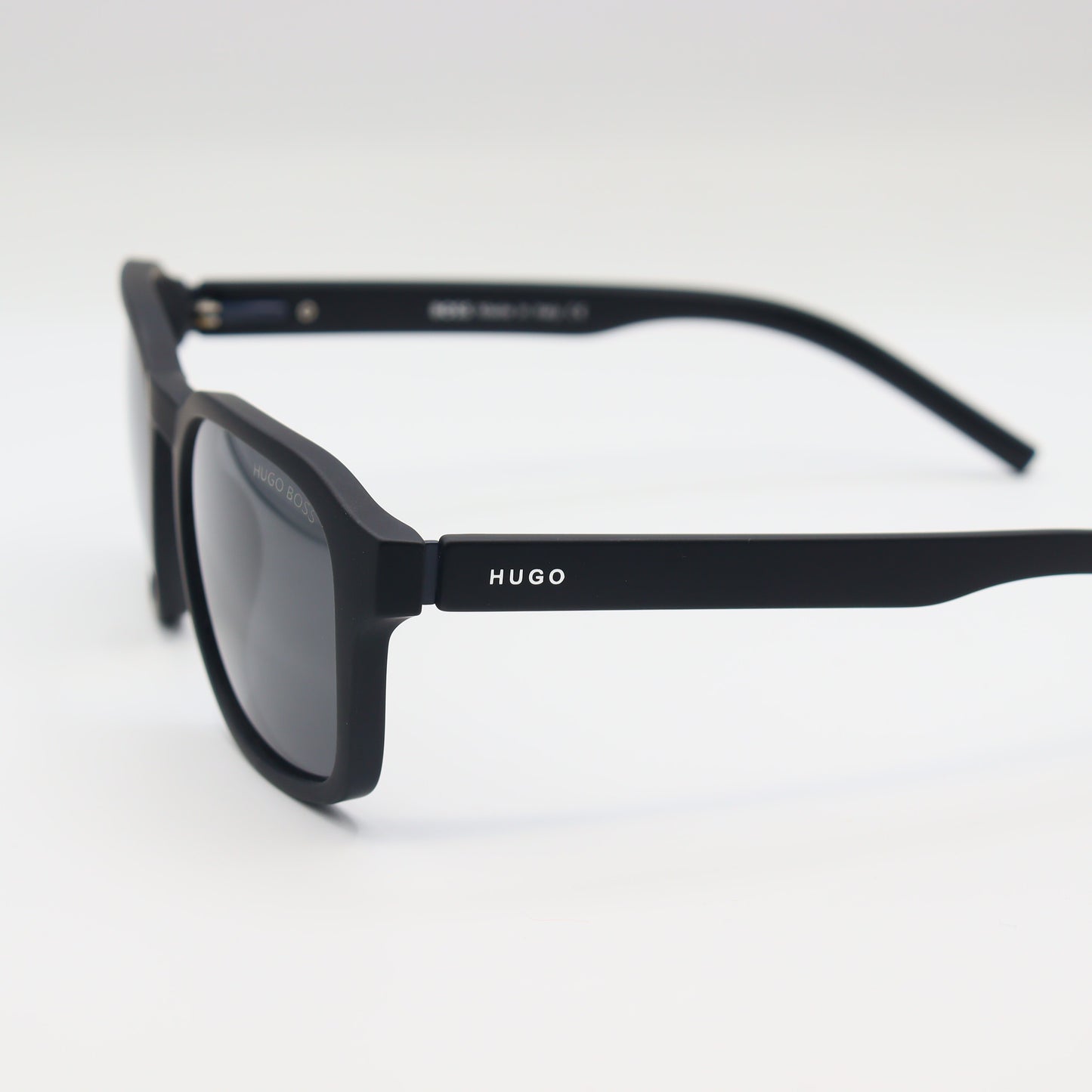 Chashmay Khas® square polarized sunglasses with HUGO BOSS branding, featuring dark tinted lenses and sleek black frames.