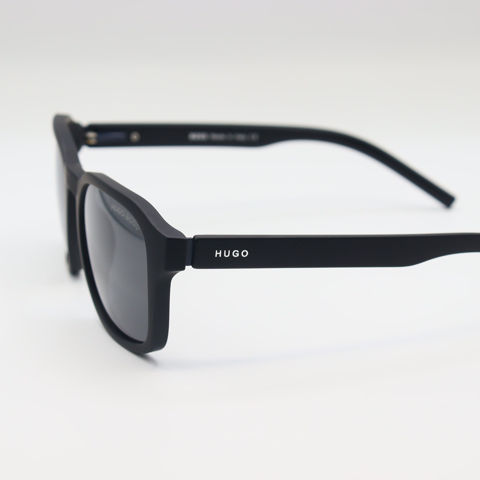 Chashmay Khas® square polarized sunglasses with HUGO BOSS branding, featuring dark tinted lenses and sleek black frames.