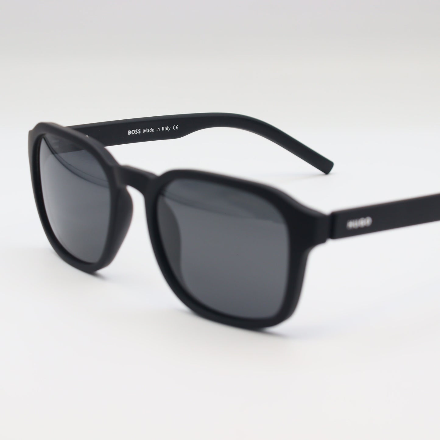 HUGO BOSS square polarized sunglasses with black frames and dark lenses, stylish and protective for outdoor wear.