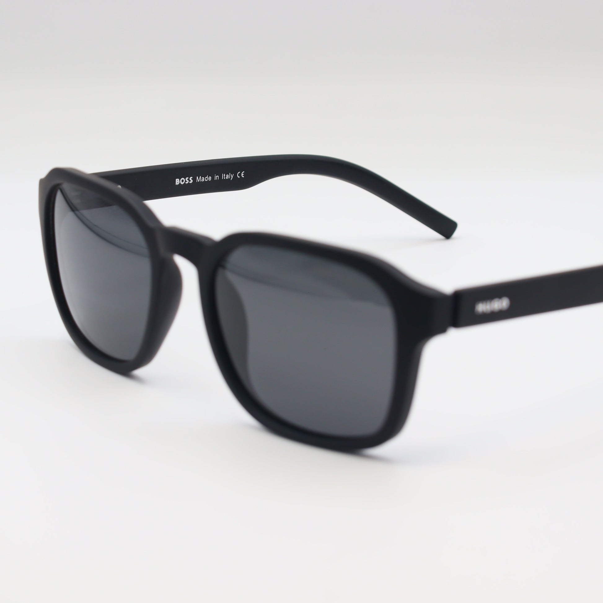 HUGO BOSS square polarized sunglasses with black frames and dark lenses, stylish and protective for outdoor wear.