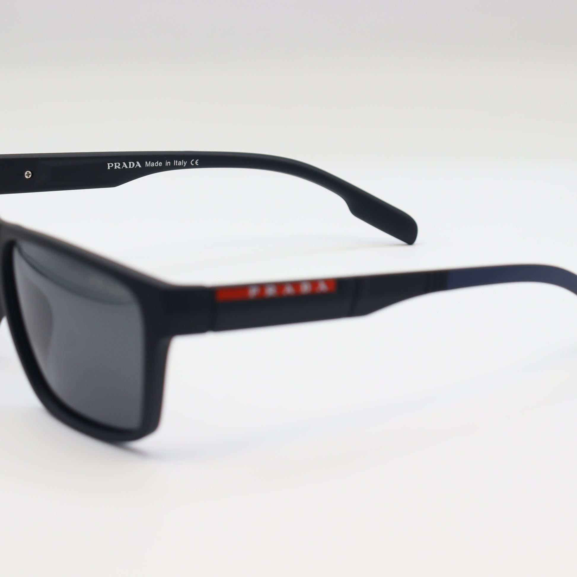 Prada square polarized sunglasses with matte black frame, stylish and UV-protective for a modern look.
