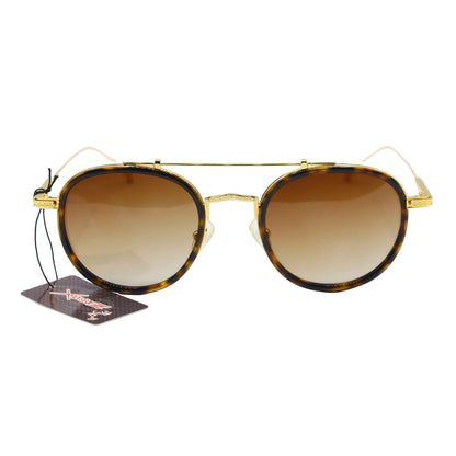 Vintage round sunglasses by CHASHMAY KHAS® with tortoise shell frames, gold accents, and polarized lenses.