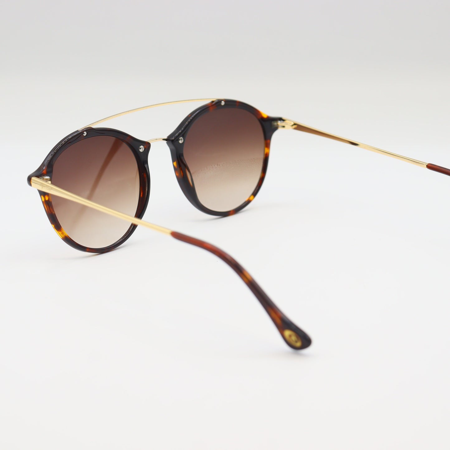 Giorgio Armani tortoise shell round sunglasses with gold double bridge and sleek frame, stylish eyewear for a sophisticated look.