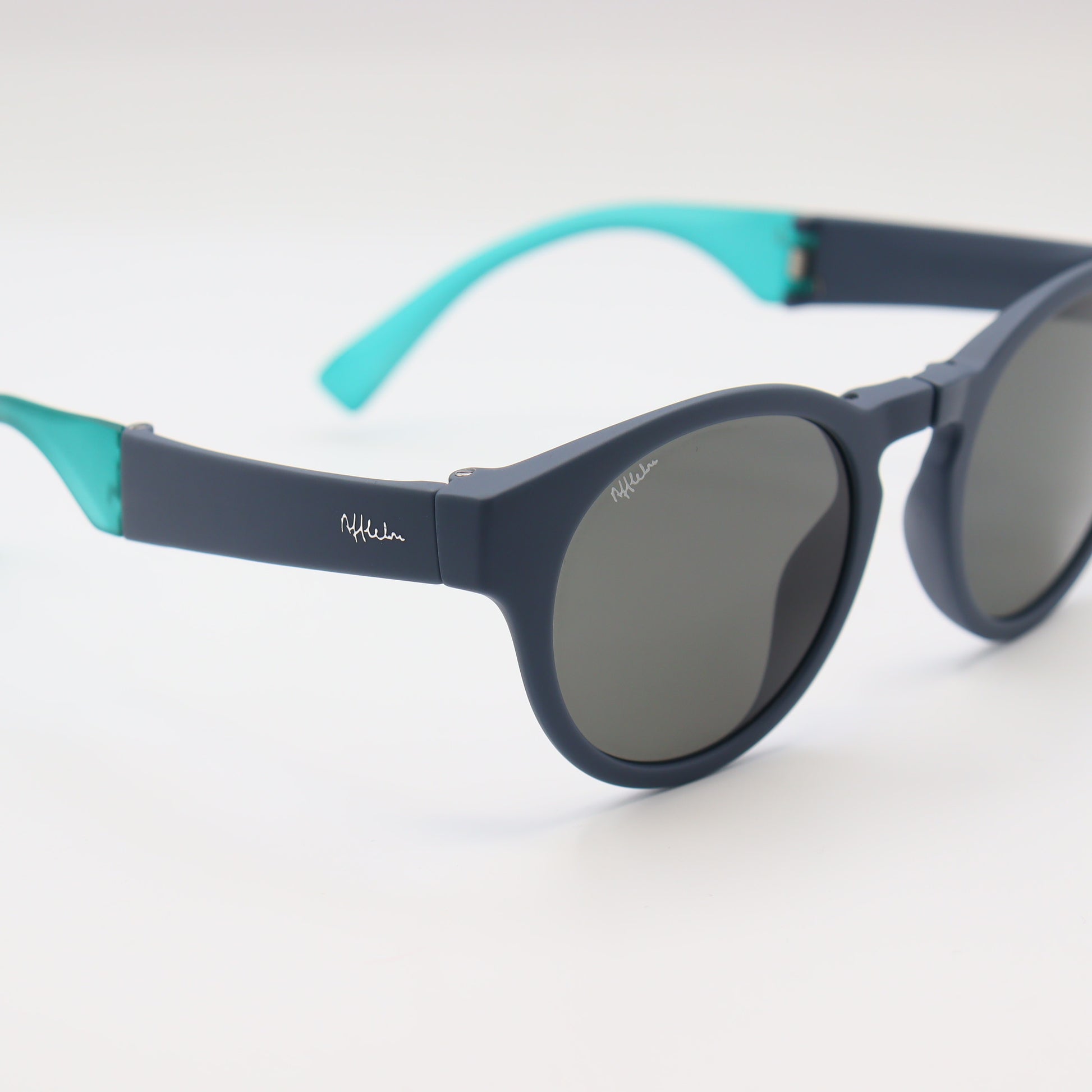 Off-White blue round sunglasses with matte navy frames and turquoise accents, stylish and trendy eyewear by CHASHMAY KHAS®.