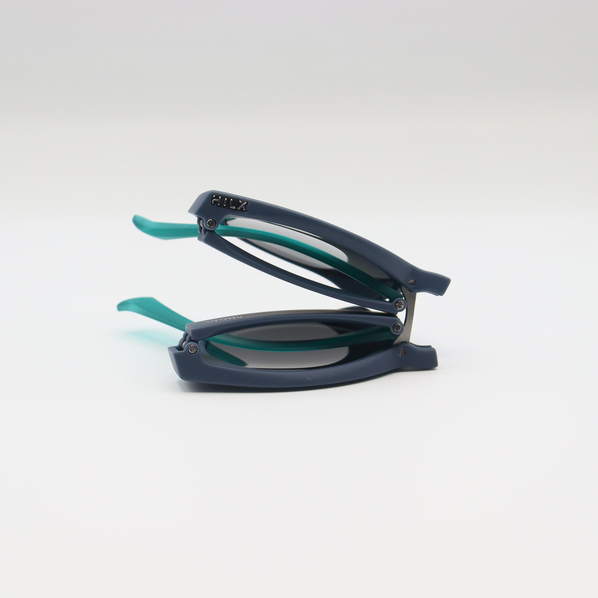 Off-White blue round sunglasses with matte navy and turquoise frames, featuring sleek design and tinted lenses.